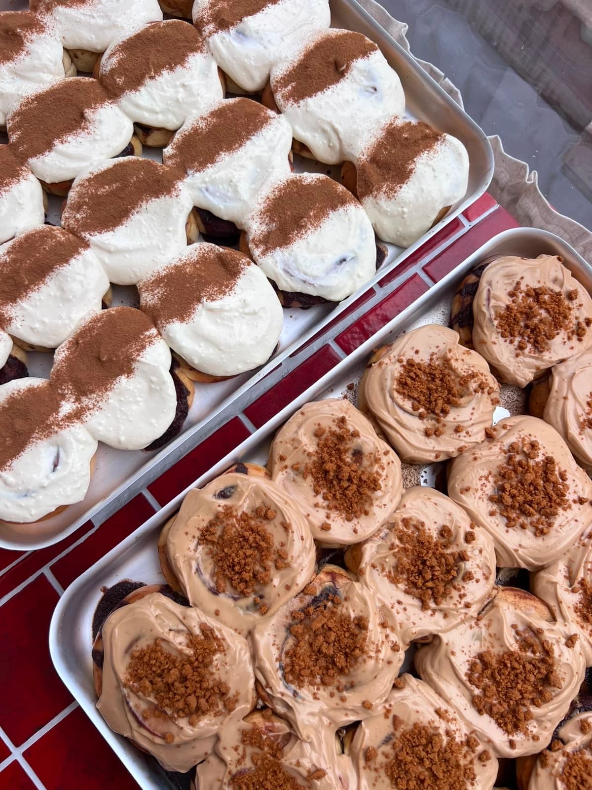 Rise and Bun Soho - freshly baked cinnamon and Biscoff buns on trays in London